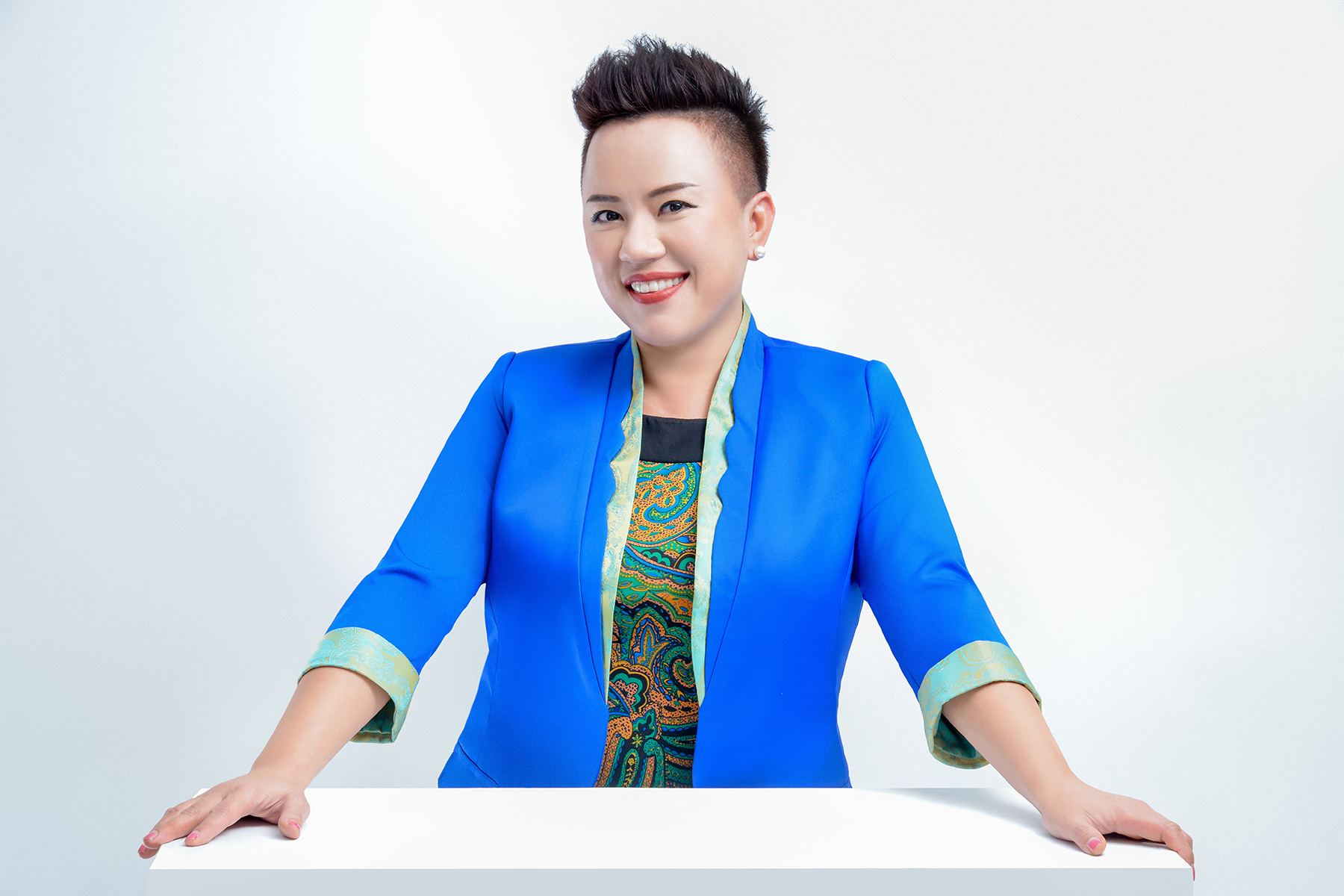 Maxine Standing at Table High Res.jpg